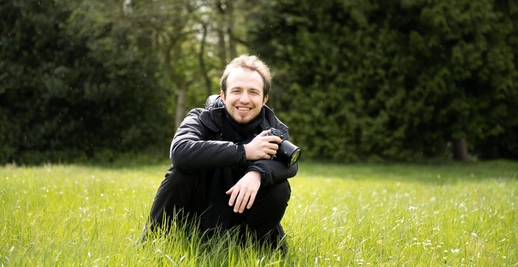 Me sitting in grass with camera